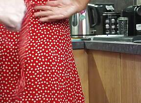 Mature Cooking in Kitchen Gets Her