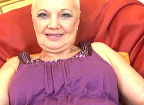Horny mature slut playing in her chair