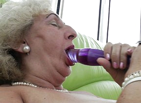 mature grandma playing with a purple
